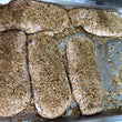 Load image into Gallery viewer, Duck breasts being cured with spices for prosciutto
